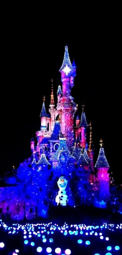 Magical castle illuminated at night with vibrant lights and colorful display.