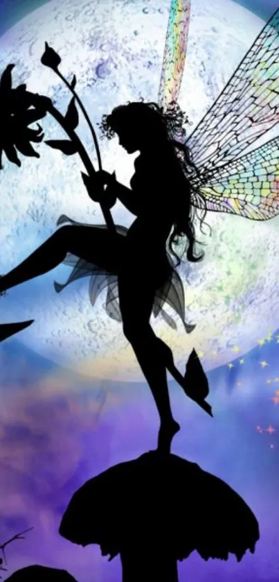 Silhouette of a fairy with colorful wings against a moonlit sky.