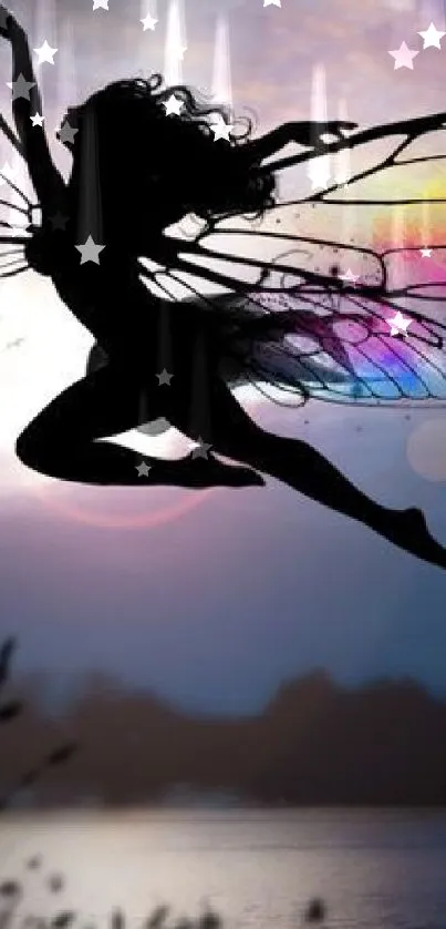 Silhouette of fairy with colorful wings over a lake at dusk.