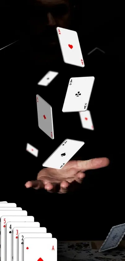 Floating playing cards on black backdrop.