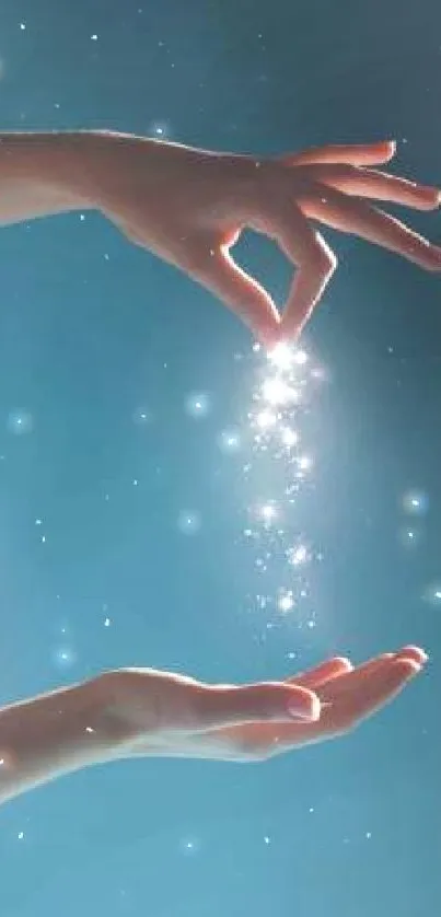 Hands releasing shimmering glitter against a turquoise blue background.