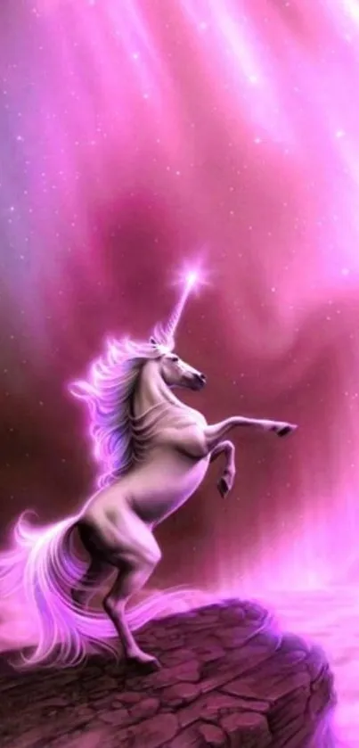 Unicorn rearing under a vibrant pink aurora.