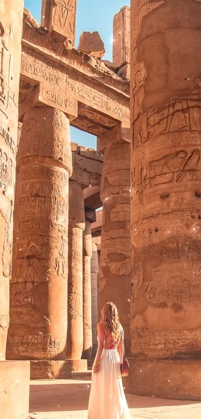 Majestic ancient ruins with towering columns and a clear blue sky.