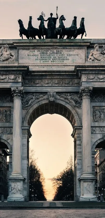 A majestic arch at sunset with a warm, glowing sky.