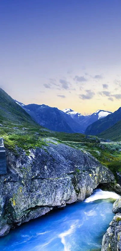 Majestic mountain landscape with blue sky and river.