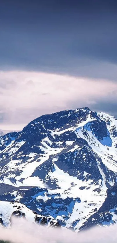 Majestic snow-covered mountain with blue sky