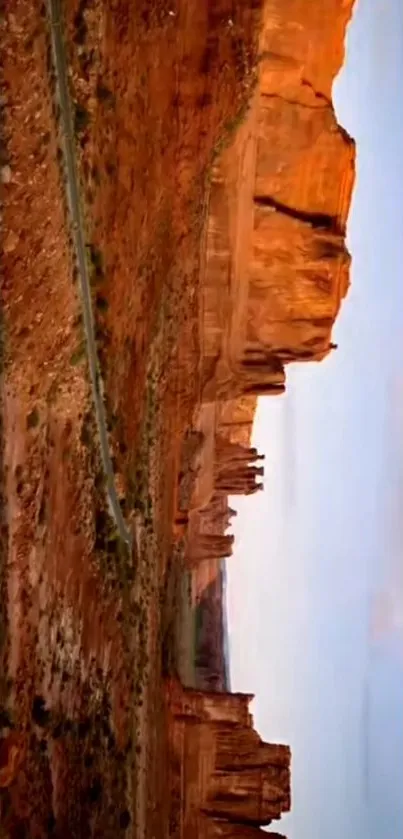 Majestic canyon at sunset with red rock formations.