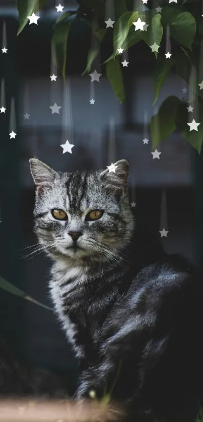 A silver tabby cat sits gracefully under garden foliage.