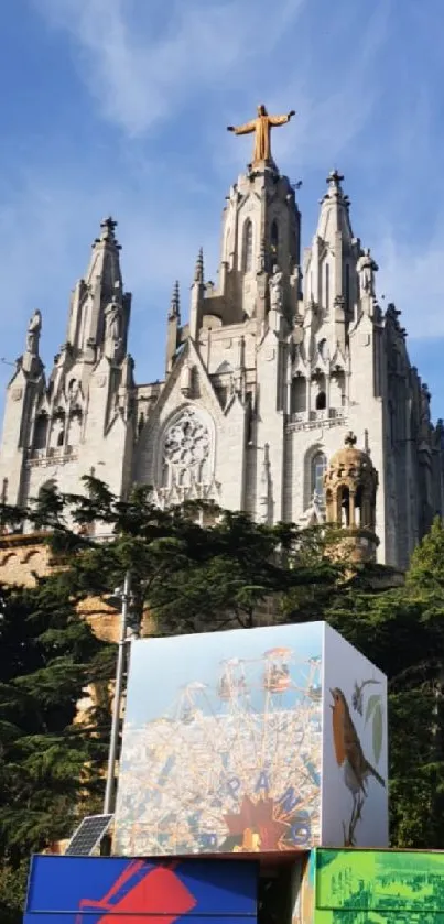 Cathedral with colorful art murals under a blue sky.