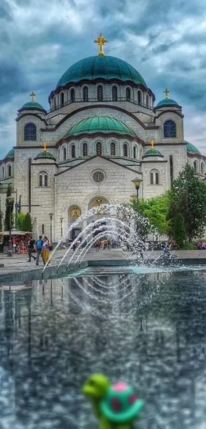 Church reflection with fountain under a dramatic sky.