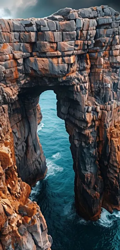 Majestic coastal rock arch above ocean waters.