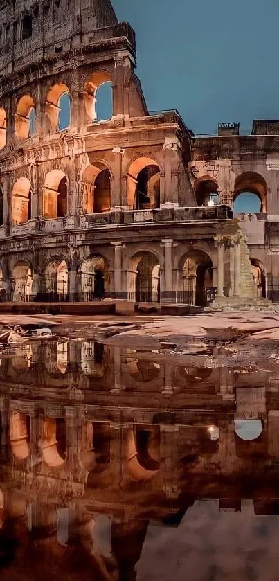 Colosseum at night with reflections in water.