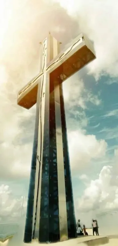 Majestic cross rising into blue sky with clouds.