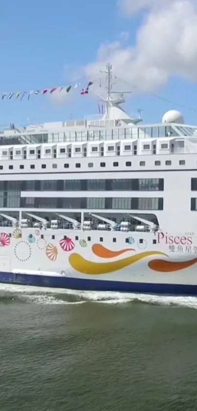 Cruise ship sailing under clear blue sky on calm ocean waters.