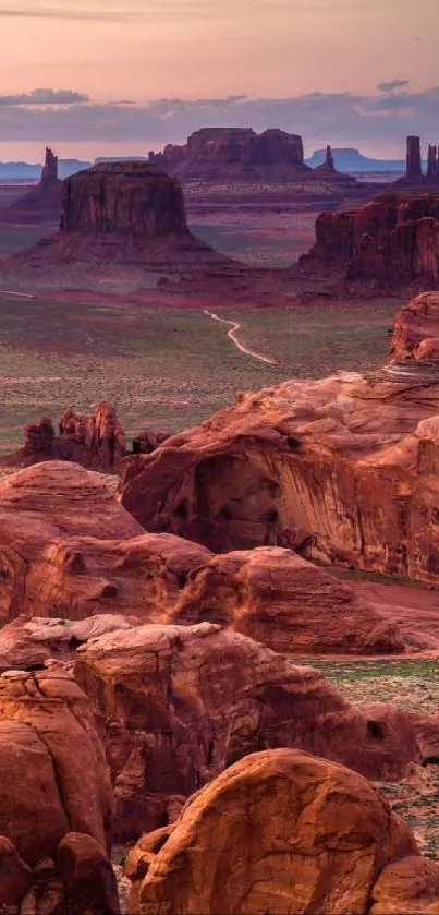 Stunning desert landscape with red rock formations at sunset.