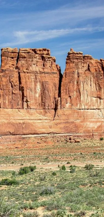 Desert rock formation under clear sky.