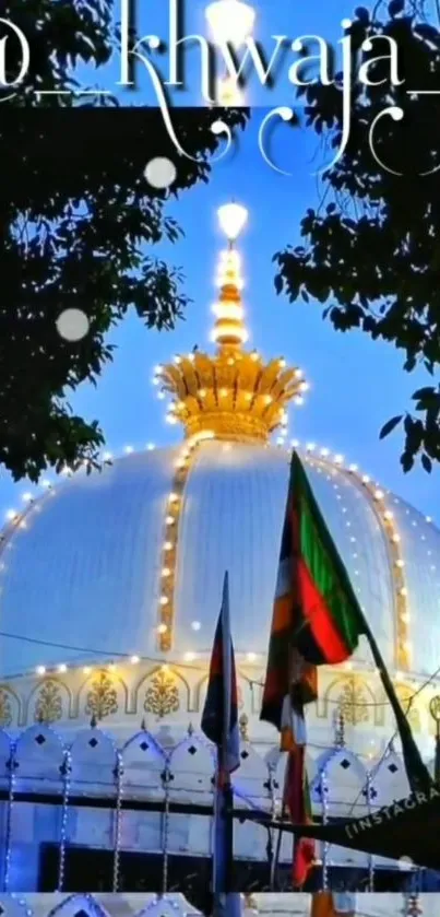 Illuminated dome at night with a vibrant blue sky backdrop.