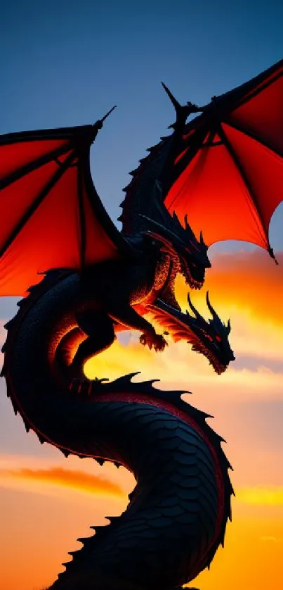 Majestic dragon silhouette against a vibrant orange sunset sky.