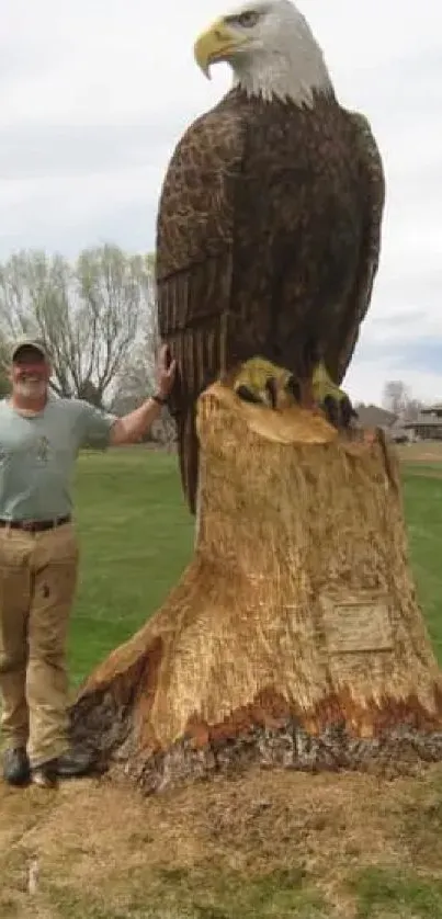 Tall wooden eagle sculpture in scenic park.