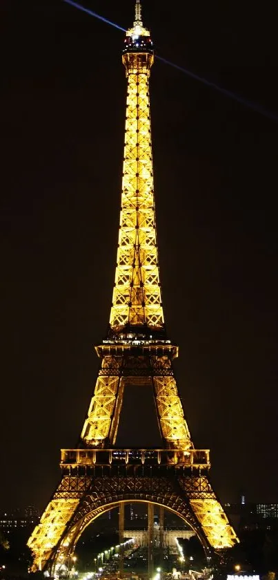 Eiffel Tower lit up against a dark sky.