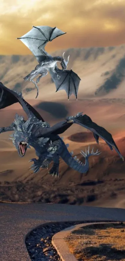 Two majestic dragons fly over a desert landscape in this fantasy wallpaper.