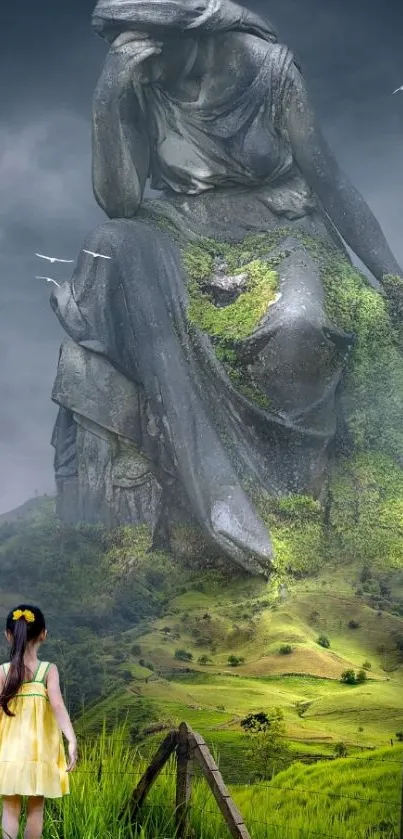 Giant stone statue with lush green hills.