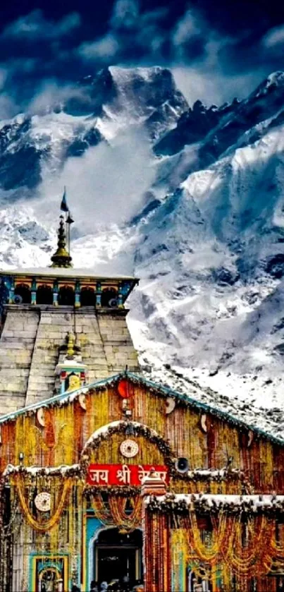 Kedarnath Temple with snow-covered Himalayan peaks in the background.