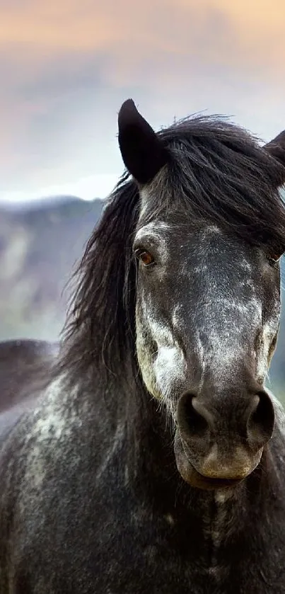 A majestic horse stands against a mountain landscape, gazing forward majestically.