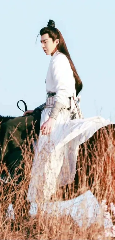 A rider on horseback wearing traditional attire in a tranquil outdoor setting.