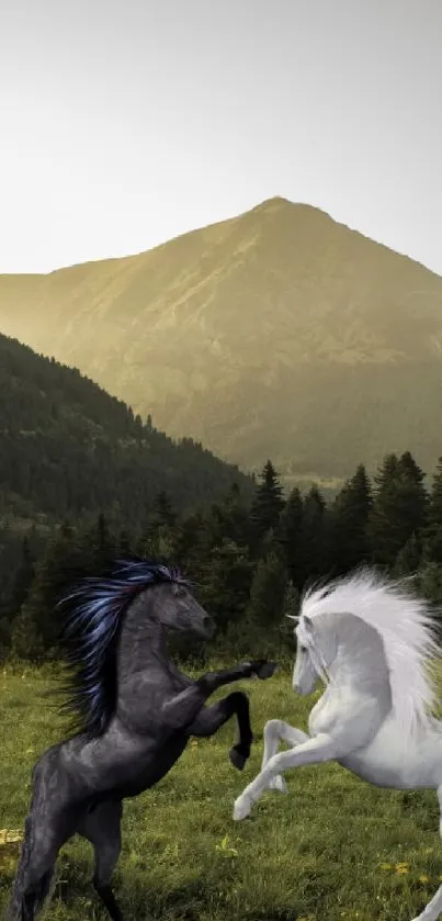 Two horses stand majestically on green field with mountains in the background.