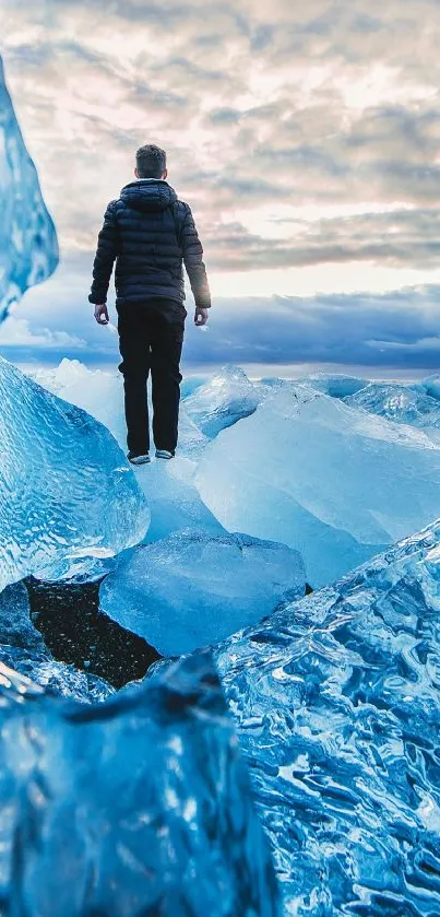 Person exploring majestic icy landscape with sky blue hues and crystal formations.