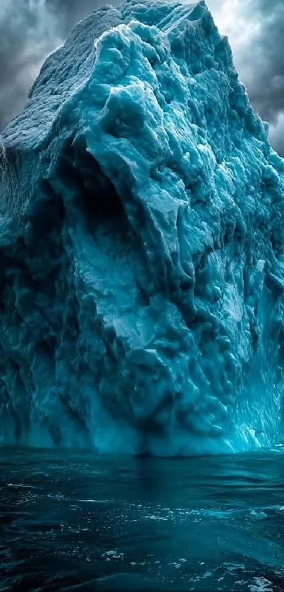 Large blue iceberg floating calmly in the ocean under a stormy sky.