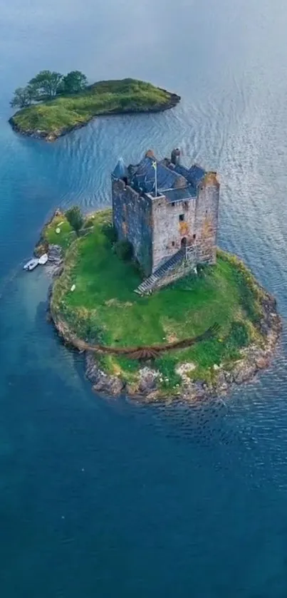 Aerial view of a medieval island castle surrounded by blue waters.