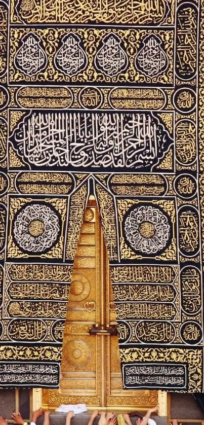 Golden Kaaba door with intricate patterns and worshippers below.