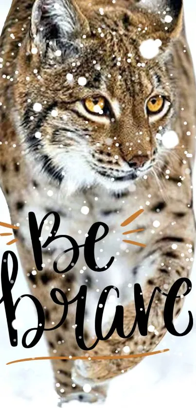 Lynx in snow with 'Be Brave' text overlay, perfect for a motivational wallpaper.