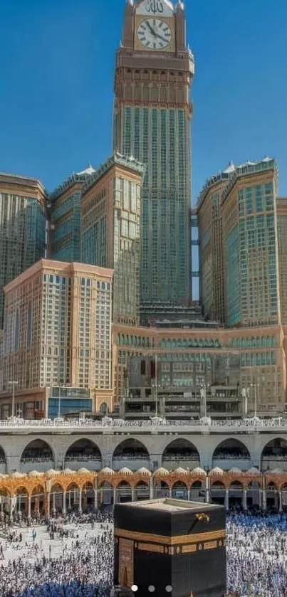 Mecca skyline with Kaaba and clocktower under bright blue sky.