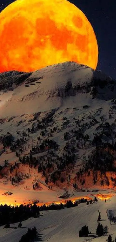 Vibrant orange moon setting over a snowy mountain landscape at night.