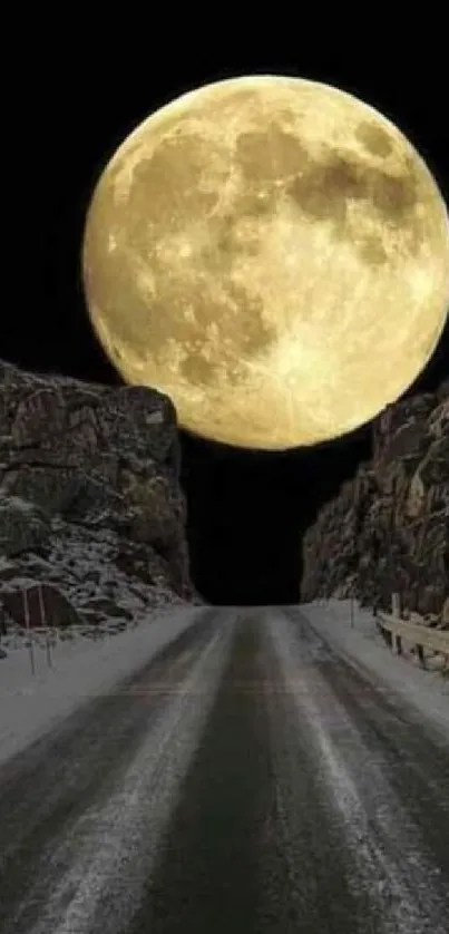 Moonlit road between rocky cliffs under a dark sky.