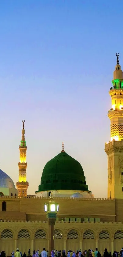 Majestic mosque silhouette at sunset with a vibrant evening sky.