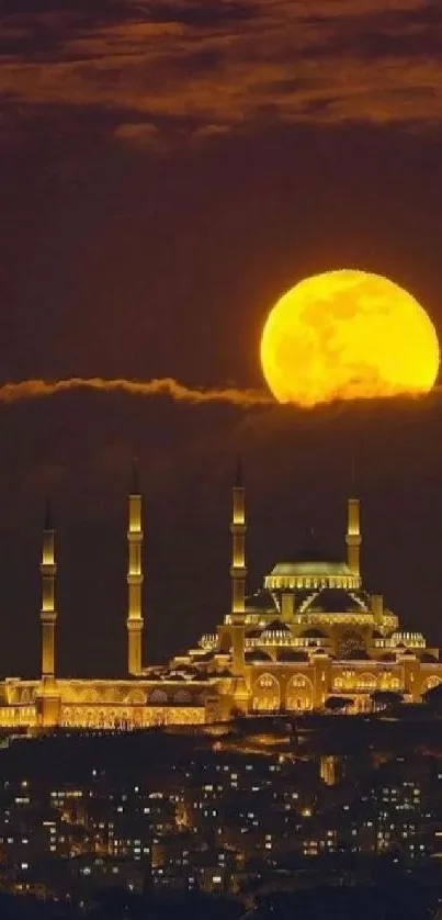 Majestic mosque under a glowing full moon at night.