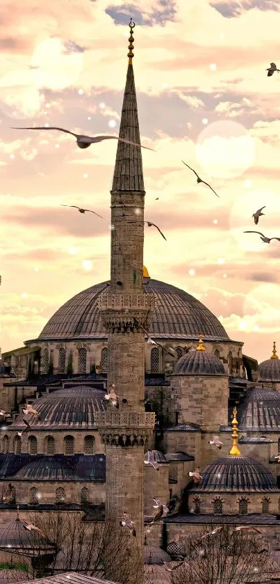 Wallpaper of mosque skyline during sunset with birds soaring overhead.