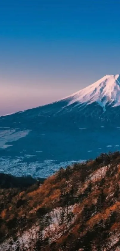 Snow-capped mountain at sunrise in scenic natural wallpaper.