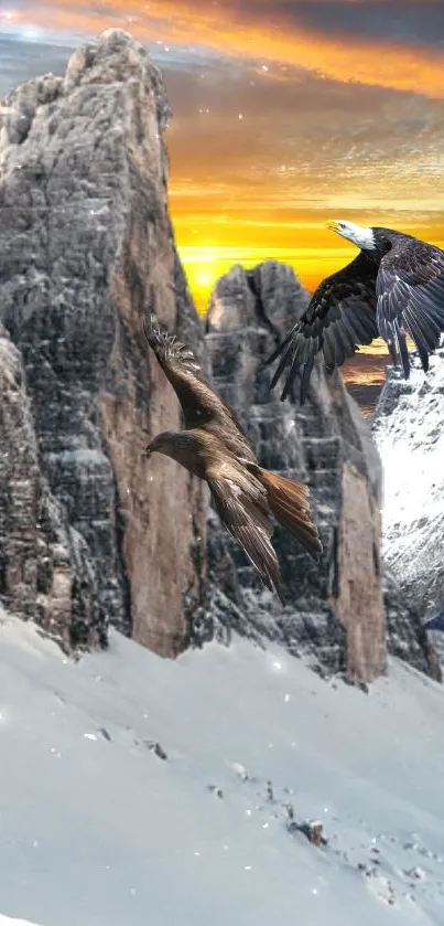 Two eagles soar over snowy mountains at sunset.