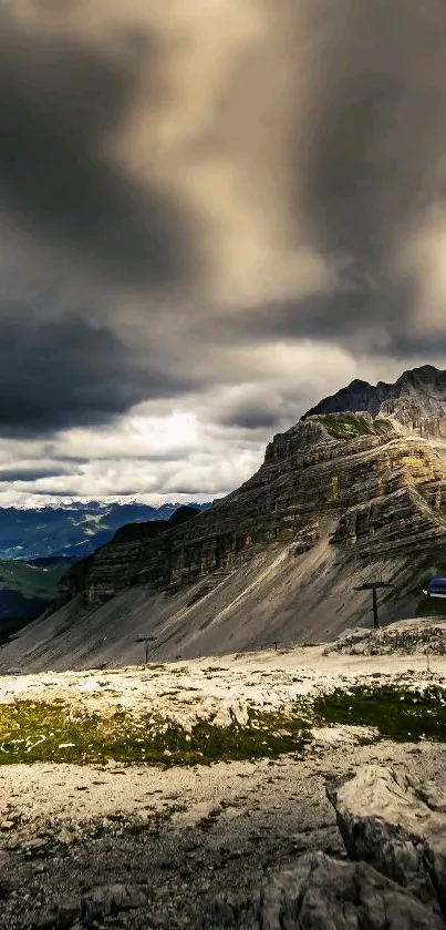 Dramatic skies over a majestic mountain landscape.