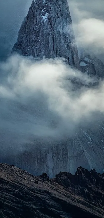 Mountain peaks with misty clouds covering them.