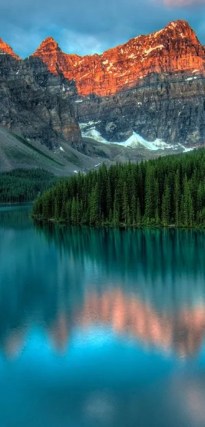 Majestic mountain landscape with a lake reflecting orange peaks and green forest.