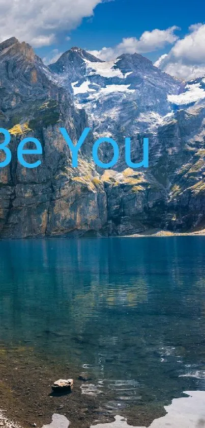 Majestic mountain lake with blue skies and serene waters.