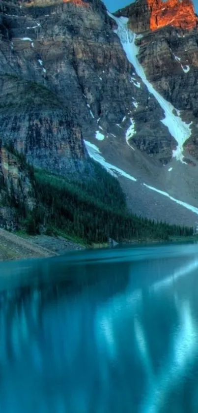 Scenic mountain lake with sunset reflection.