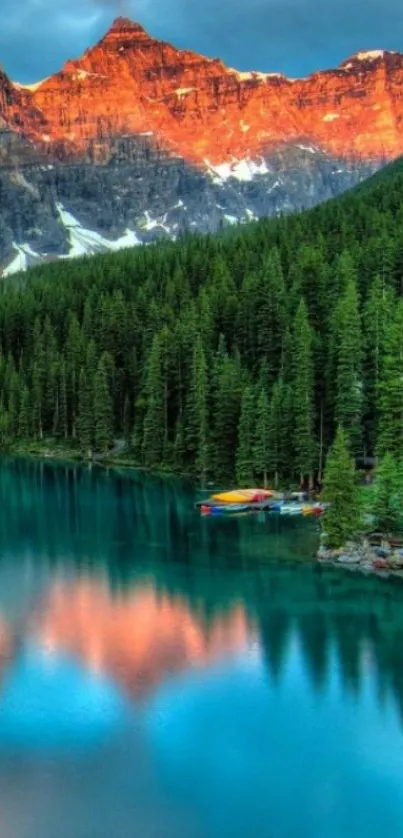 Serene mountain lake at sunrise with lush forests and colorful reflections.