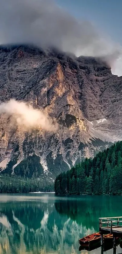 Majestic mountain and lake with pine forest reflection at sunrise.